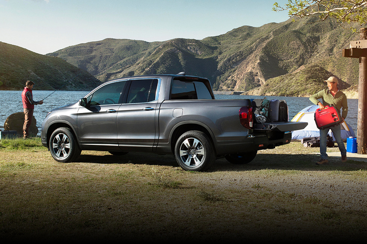2020 Honda Ridgeline RTL-E in Modern Steel Metallic profile parked near a lake while camping (Midsize Pickup Truck).