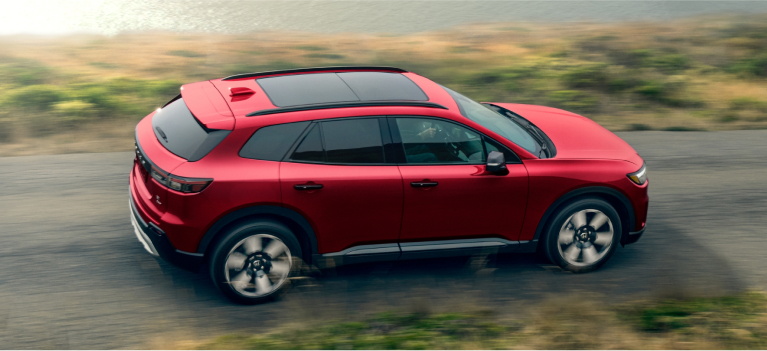 Honda Prologue driving along a coastline