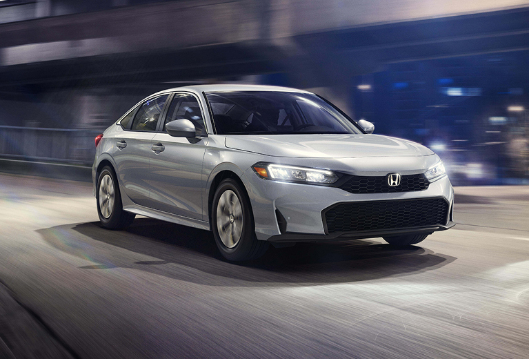 2025 Honda CIvic Sedan driving at night.
